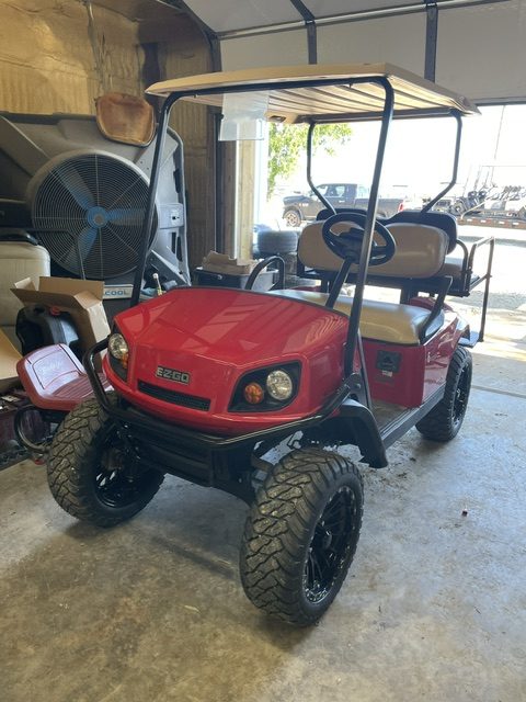 INSTOCK 5/11/26 2021 EZGO RED LIFTED TXT 48V S4 BODY W/ NEW BATTERIES 23" TERRAIN TIRES ALL EZGO PARTS WERE USED.